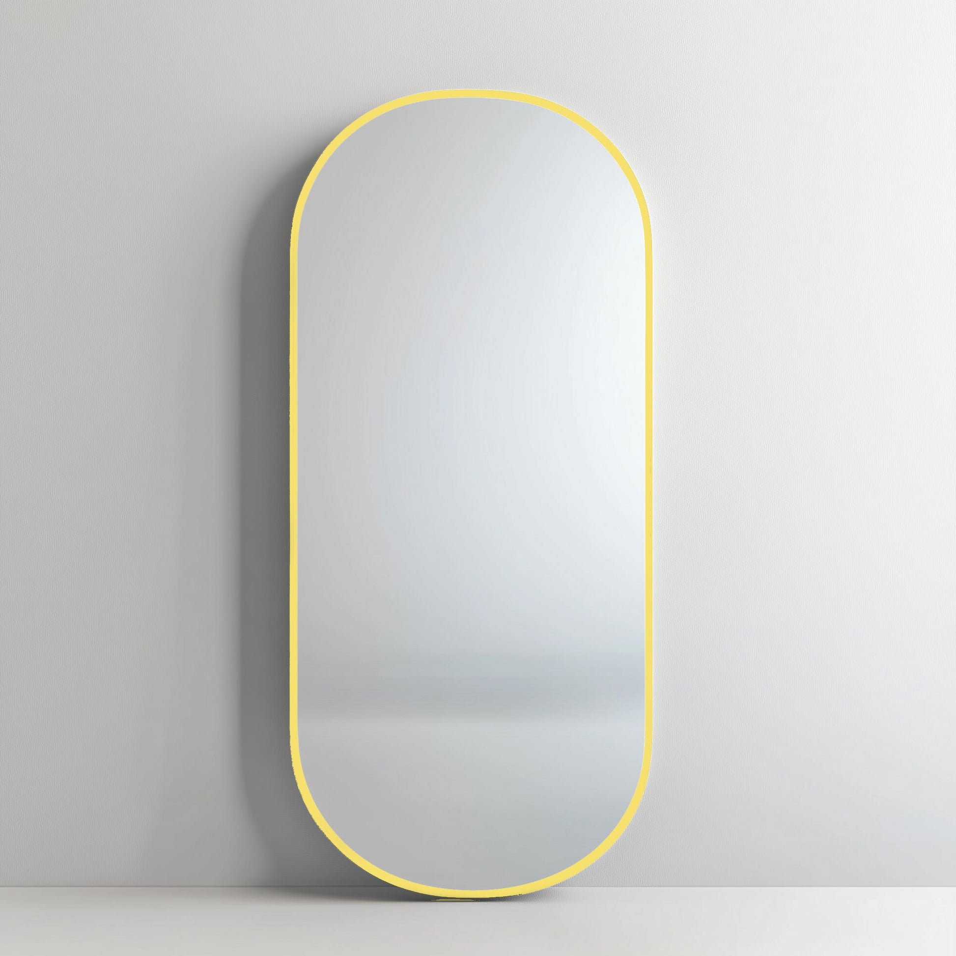 Pill 80 x 45 Duo mirror featuring a yellow aluminium frame, adding a bold, modern pop to minimalist interiors.