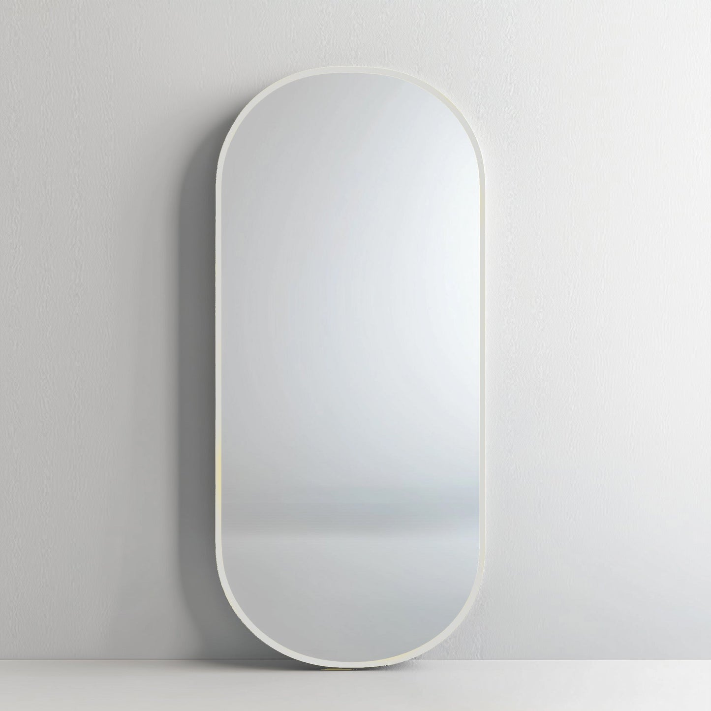 Pill 80 x 45 Duo mirror with white aluminium frame, offering a sleek and subtle addition to contemporary decor.