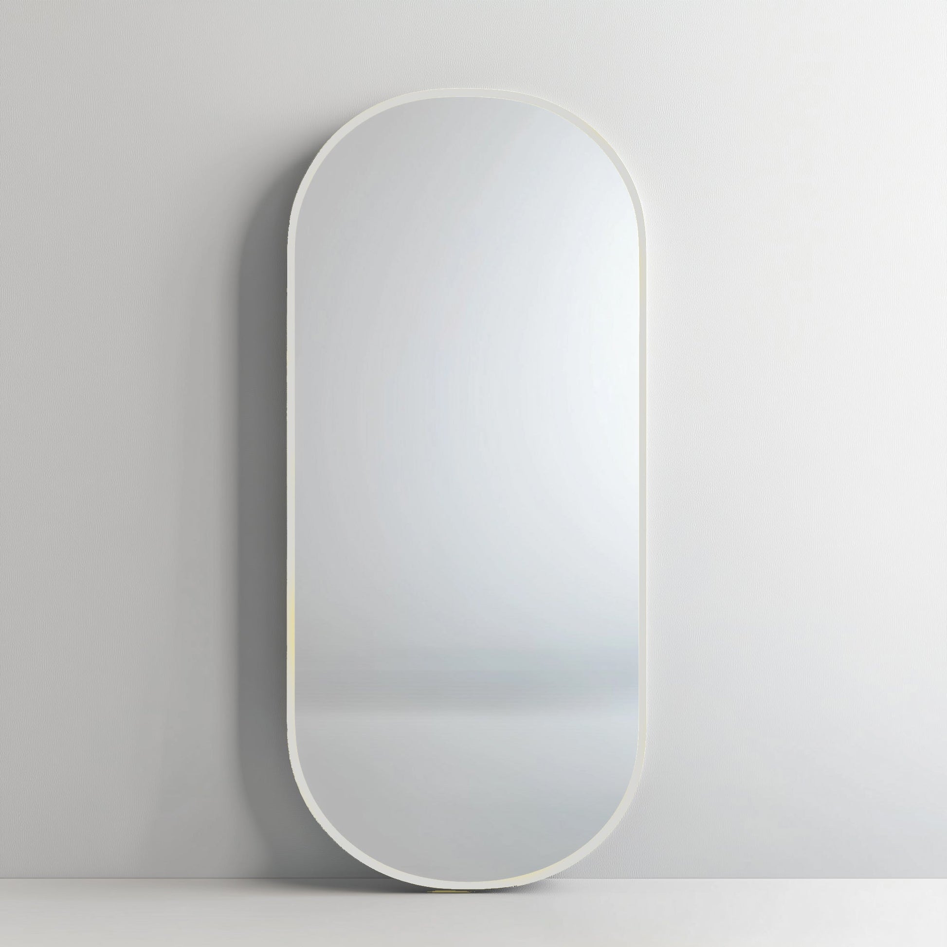 Pill 80 x 45 Duo mirror with white aluminium frame, offering a sleek and subtle addition to contemporary decor.