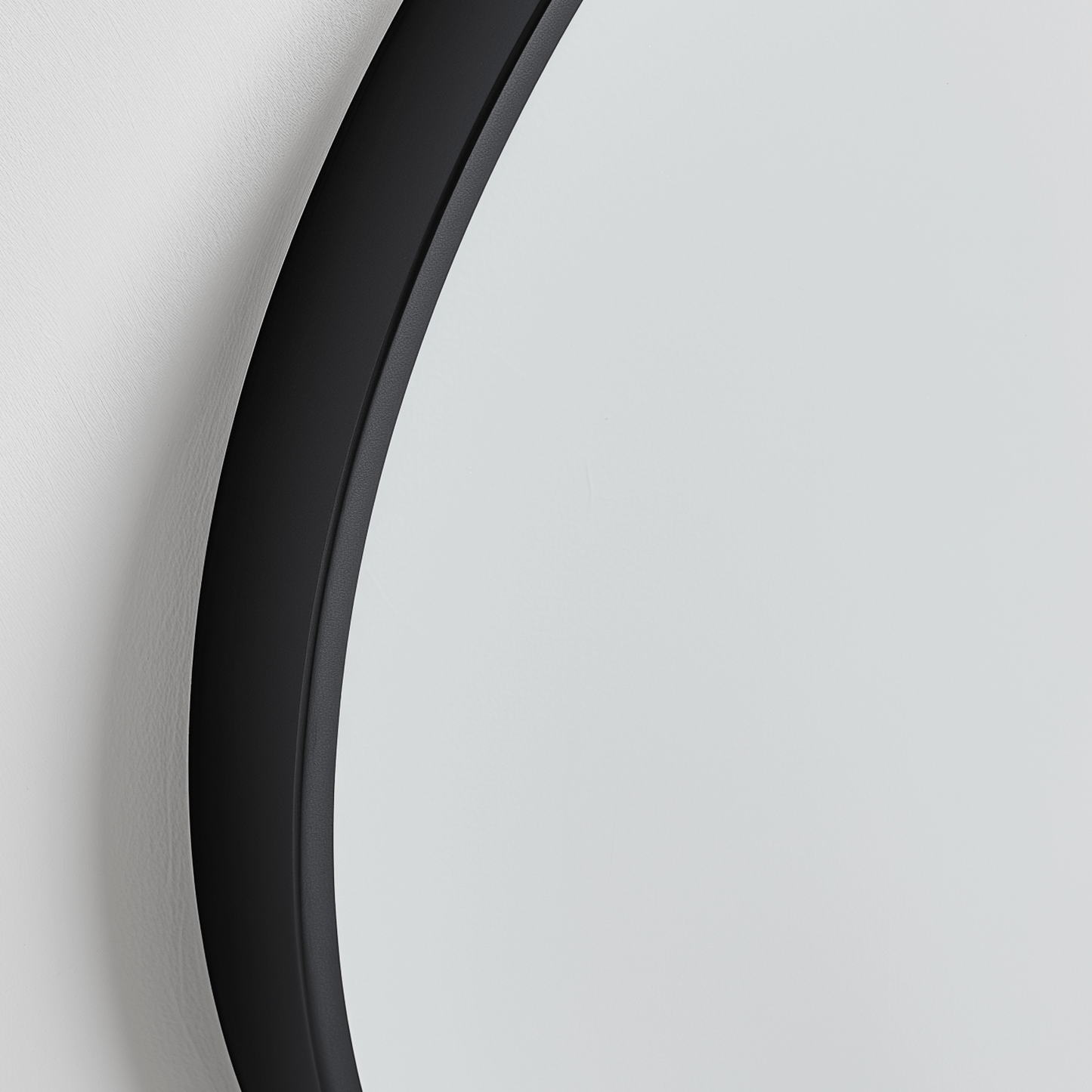 Close-up of Organic 100x88 Duo mirror with matte black frame, highlighting its smooth, curved eco-conscious design.