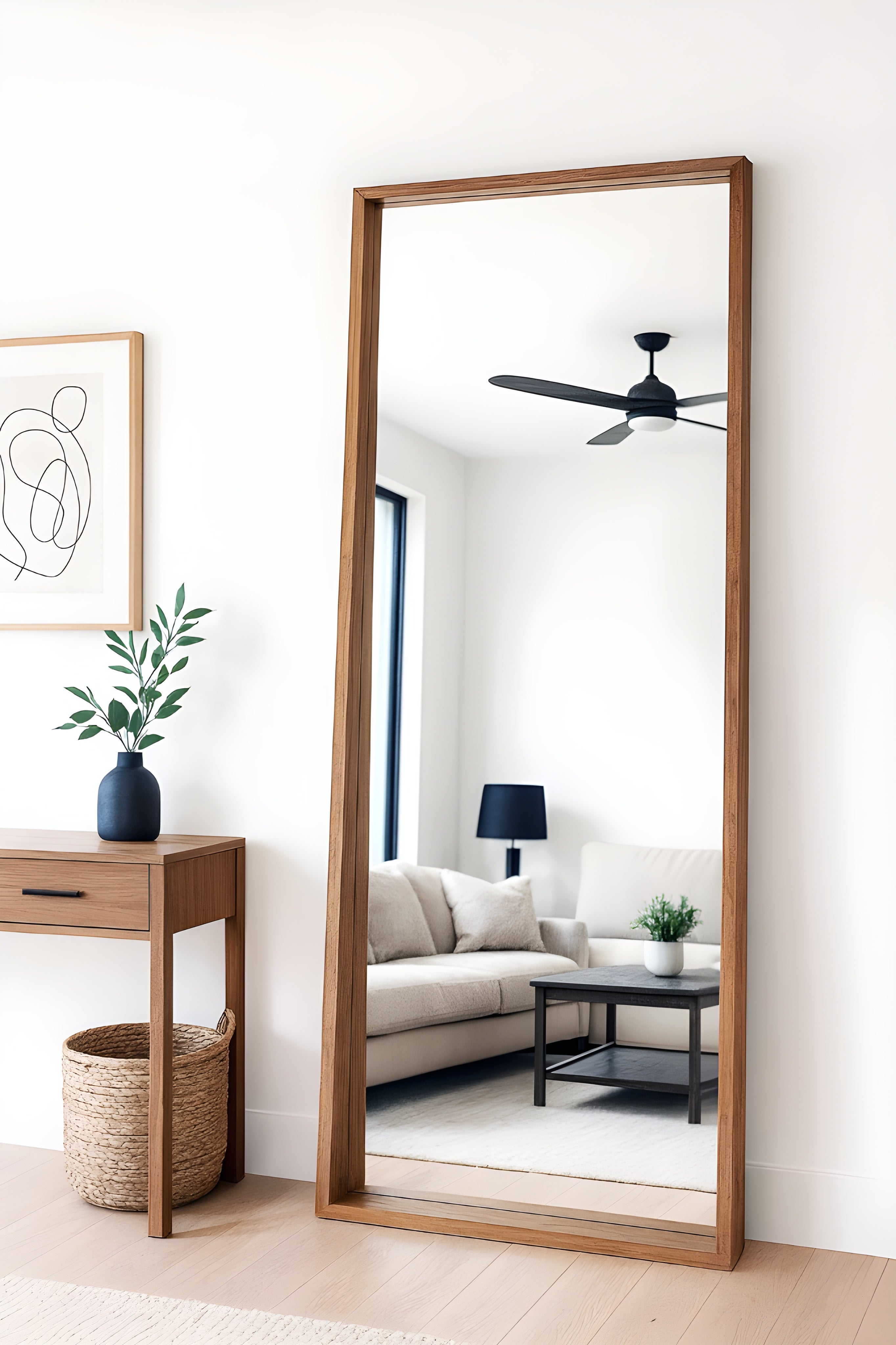 Full-length mirror with wooden frame in a living room setting