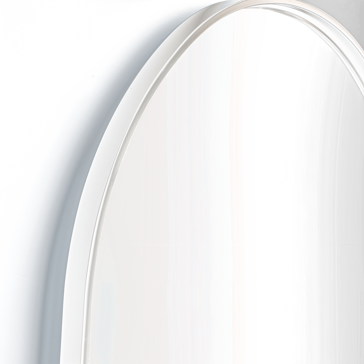 Detail view of Pill 80 x 45 Duo mirror with white frame, showcasing its high-quality aluminium construction and elegant curvature.