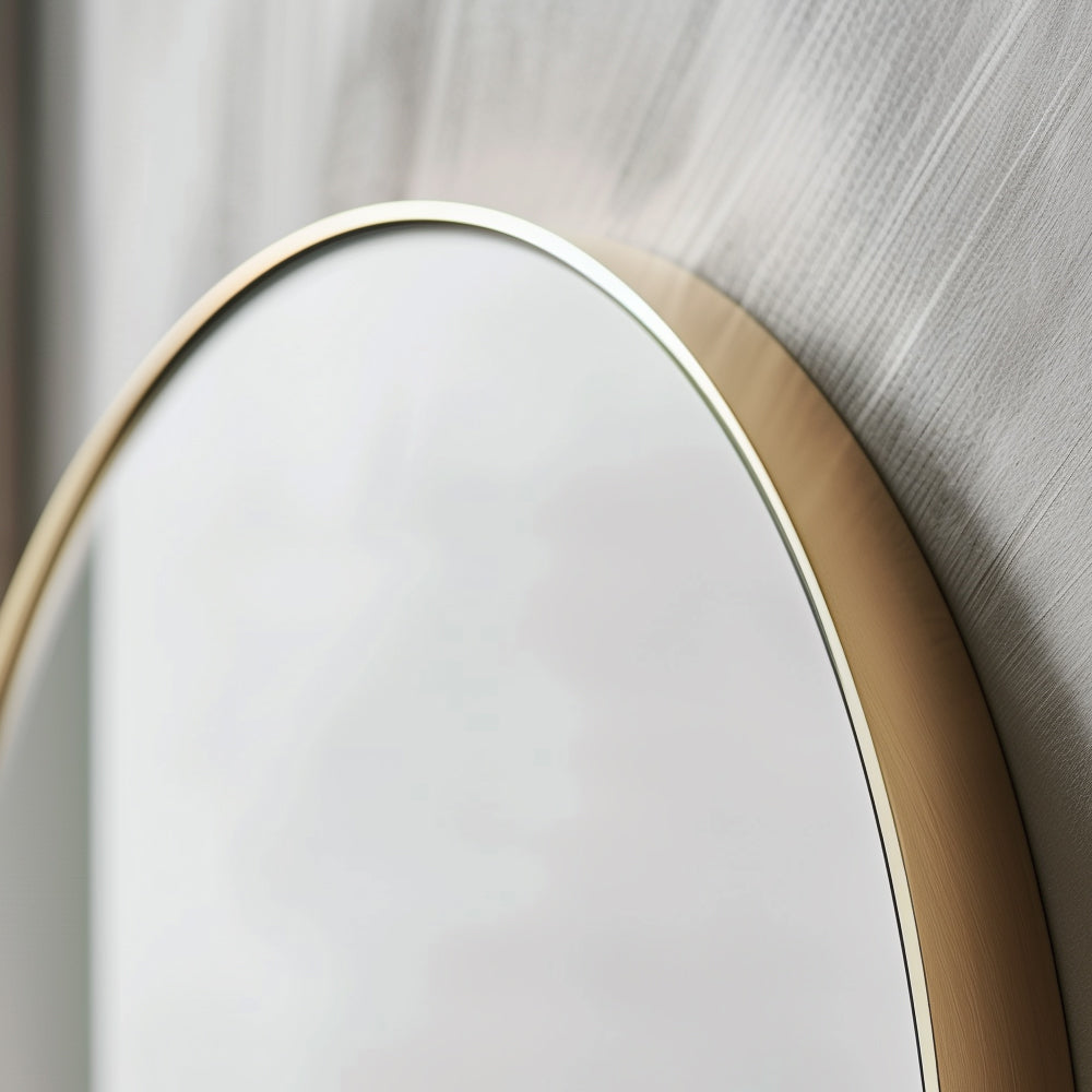 Close-up of Pill 80 x 45 Duo mirror with gold aluminium frame, highlighting its premium build and smooth curved edges.