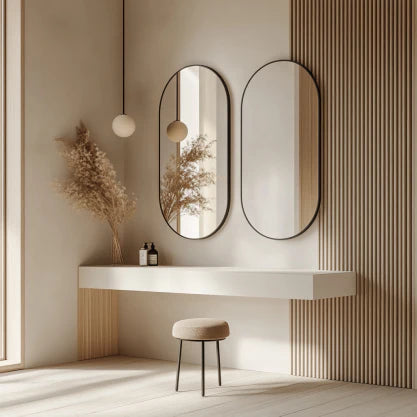 Pill 80 x 45 Duo aluminium mirrors mounted in a minimalist vanity setup, enhancing natural light and adding elegance to the space.