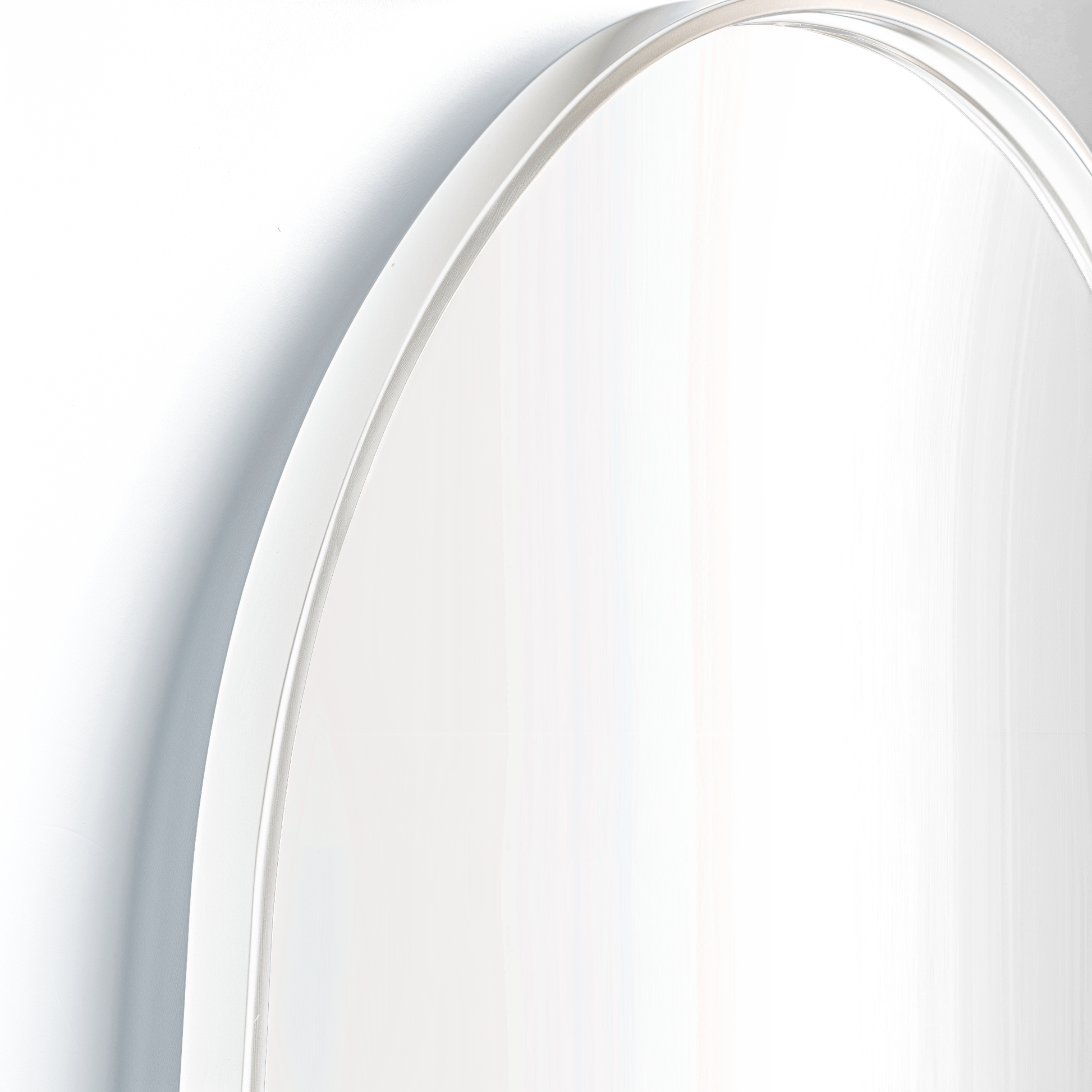 Detail view of Pill 80 x 45 Duo mirror with white frame, showcasing its high-quality aluminium construction and elegant curvature.