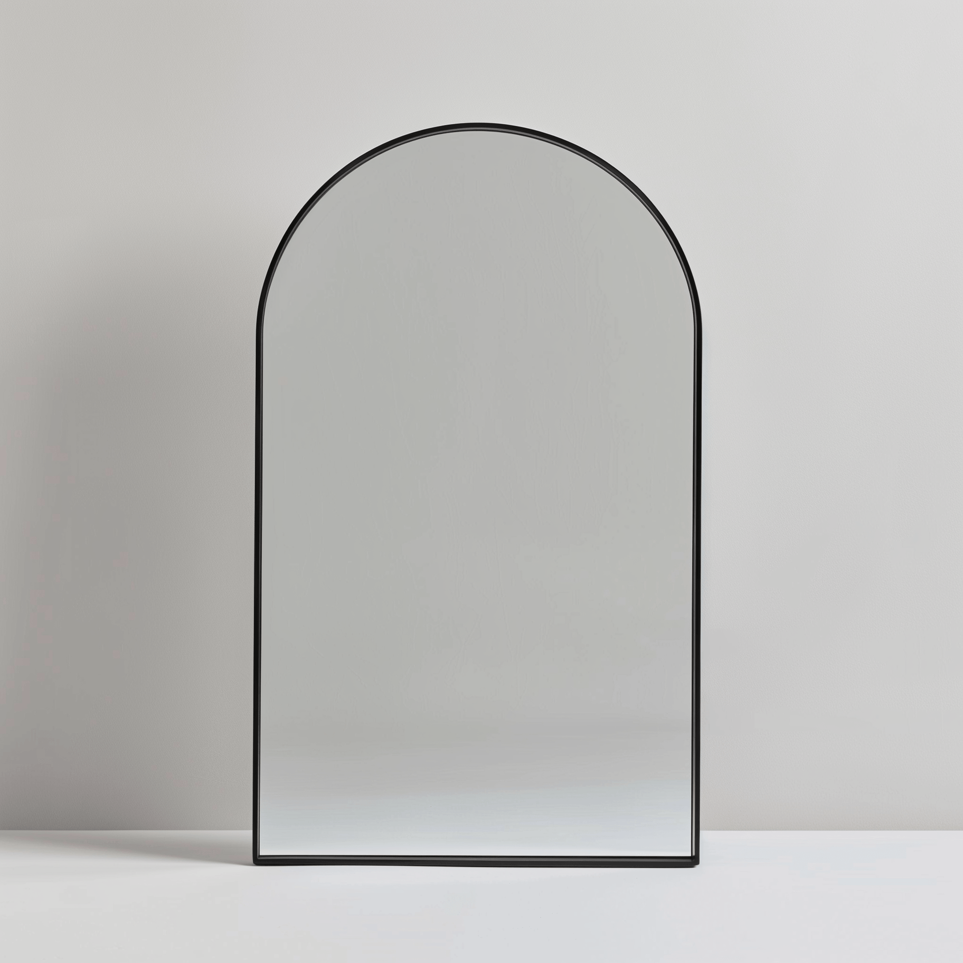 Single mirror from Arch 70 x 55cm Duo - Aluminium Mirrors Set with black frame, showcasing its sleek arched design for contemporary spaces.
